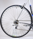 Flanders white 54cm bike's rear wheel and cassette closeup