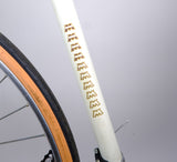 Motobecane MBK Trainer Road Bike, White 57cm, close up of seat tube and "MMMMMM" logo.